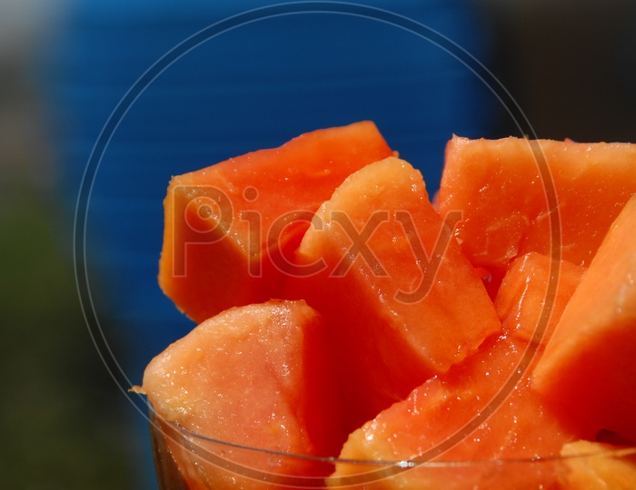 Close up shot of Papaya fruit pieces in glass cup