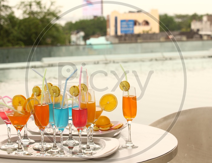 Photograph of different cocktails in glasses