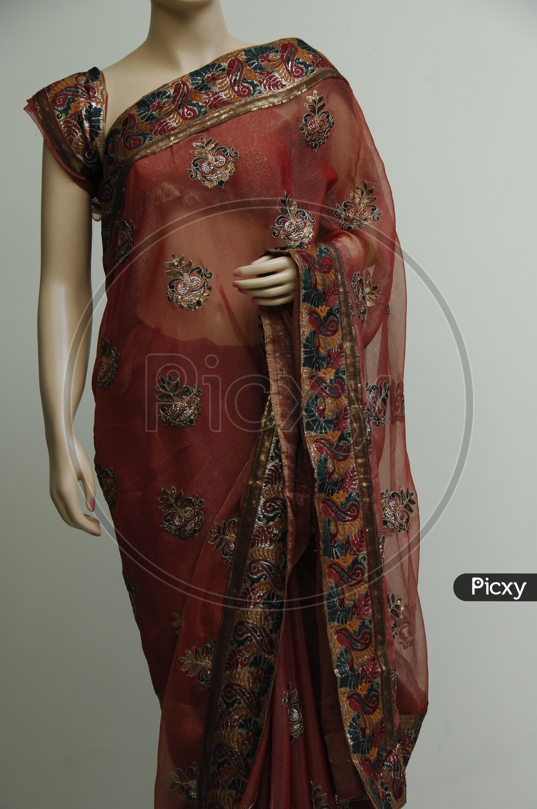 Photograph of maroon colour saree
