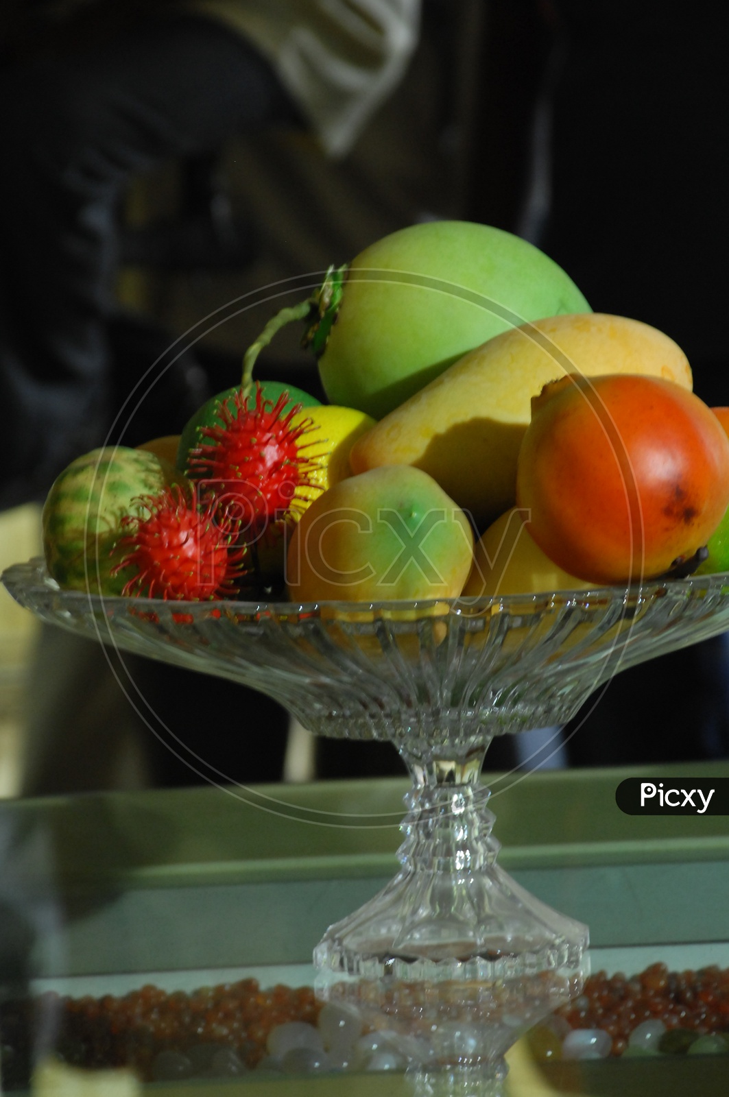 Photograph of Artificial Fruits in a glass bowl