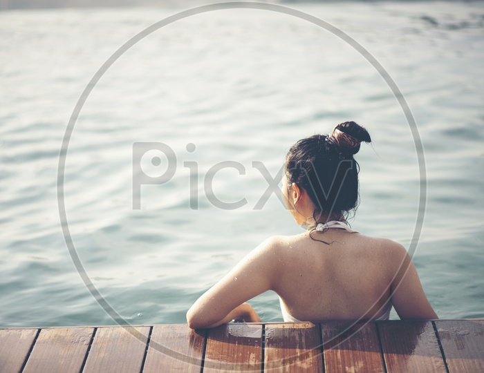 An Asian Woman On a Swimming pool