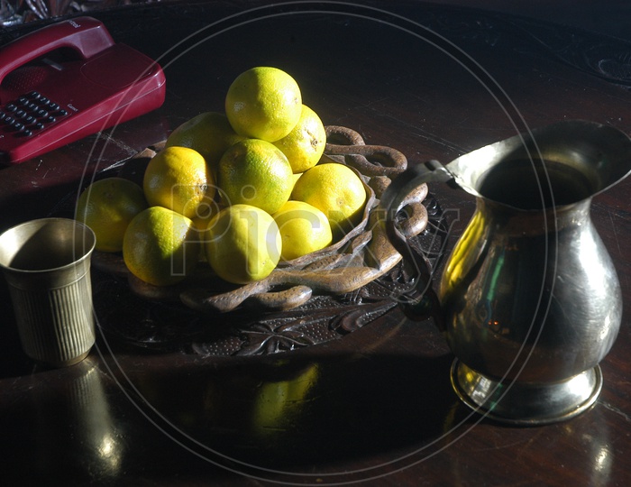 Close up shot of Orange fruits in a Bowl on a dining table