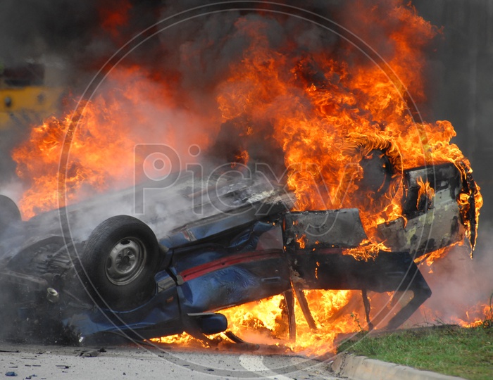 Burning car on a road