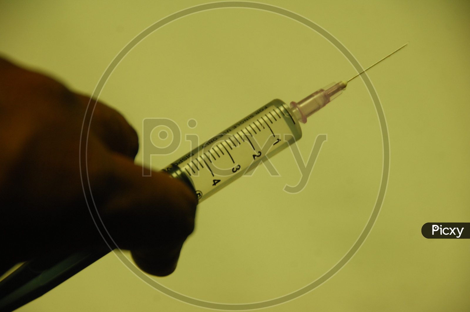 Close up shot of Syringe holding in Hand