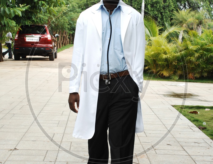 A male doctor wearing white coat with stethoscope