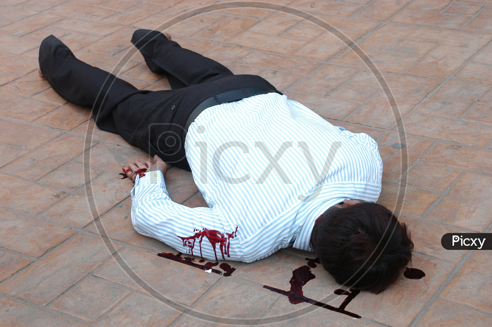 A dead man on the floor with blood stains - Movie scene