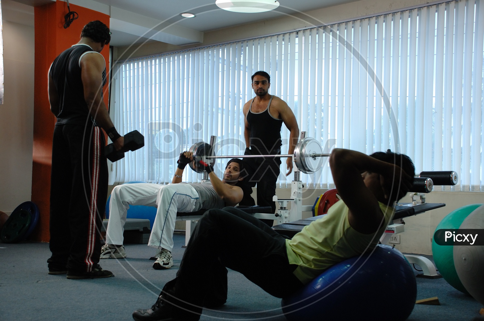 Indian men exercising at a Gym
