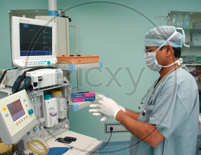 Doctor is checking ICU ECG monitor, medical equipment