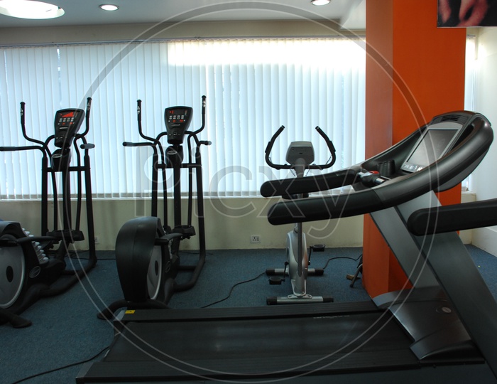 Fitness and strengthening equipment in the gym - Treadmills and cycles