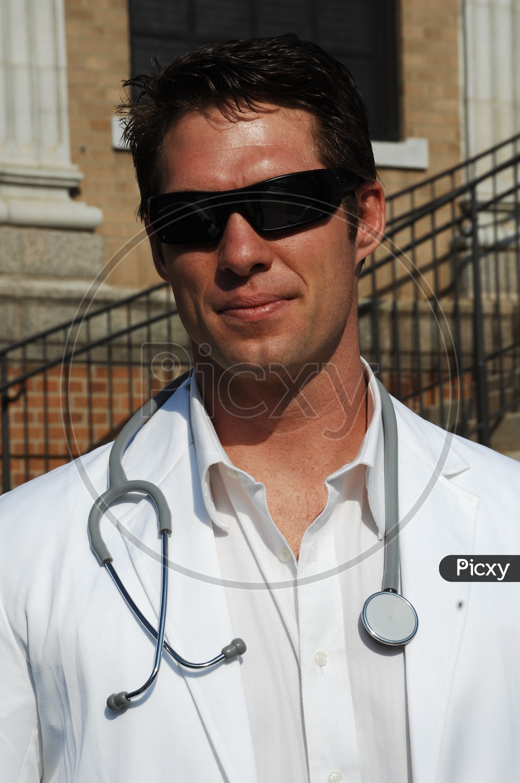 image-of-a-male-doctor-wearing-white-coat-with-stethoscope-ig922086-picxy