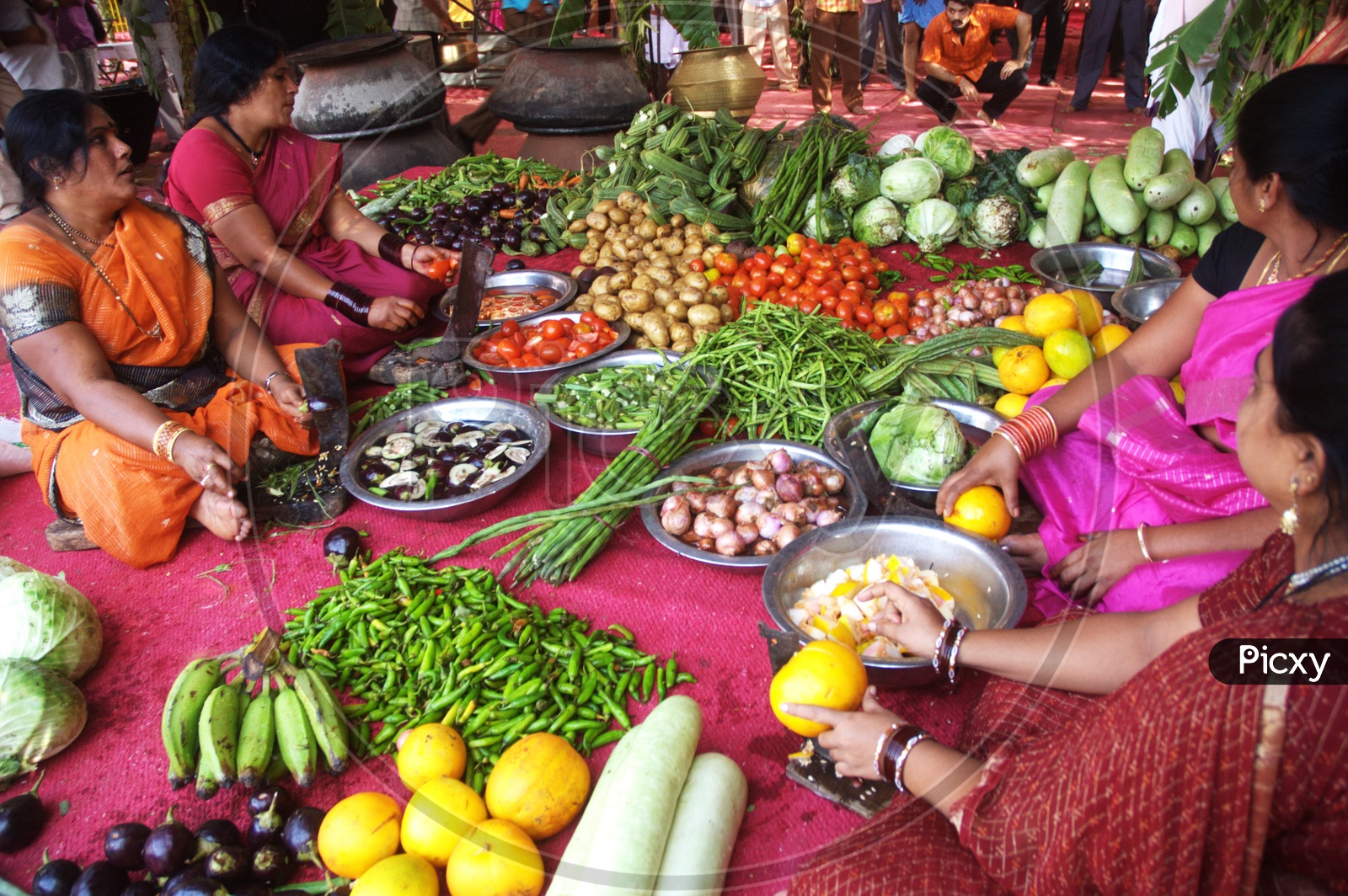 Group of women with various vegetables