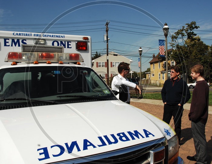 People standing at the ambulance