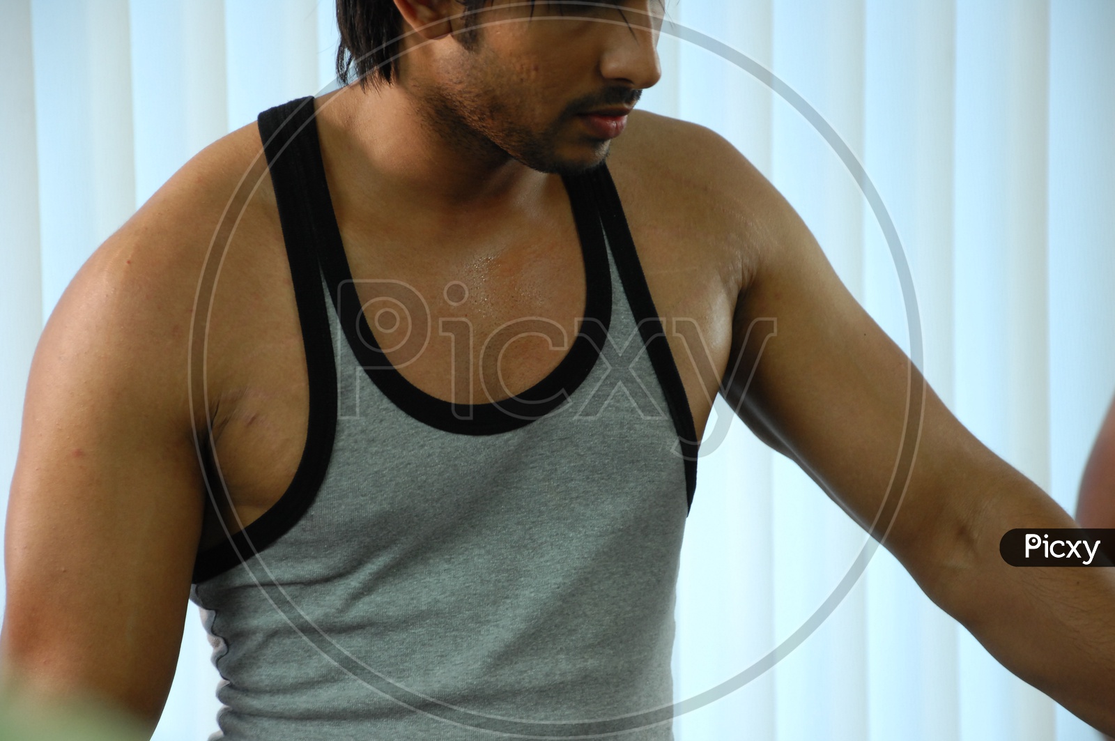 Indian man exercising at a gym