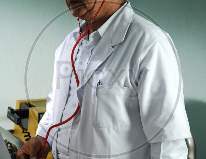 An actor as a  doctor with a white coat and stethoscope - movie scene