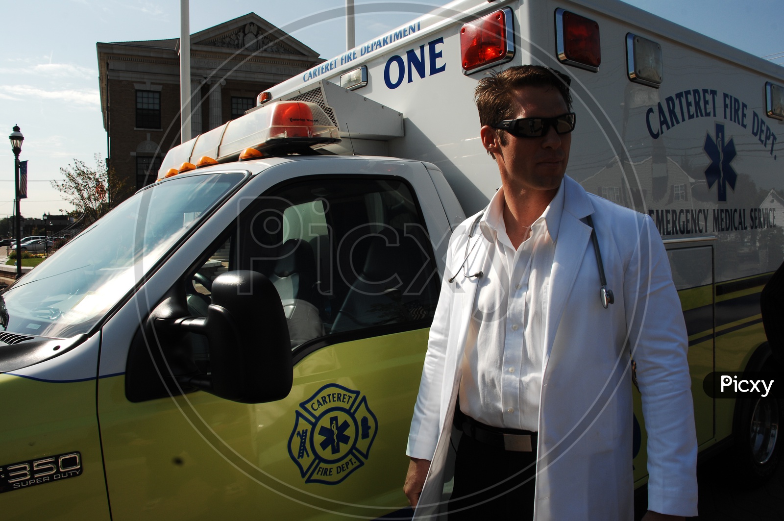 A male doctor standing at the ambulance