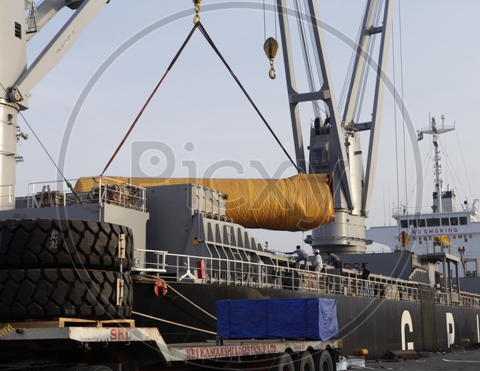 Heavy Vehicles Loading With Cargo At Port Berths From Ships