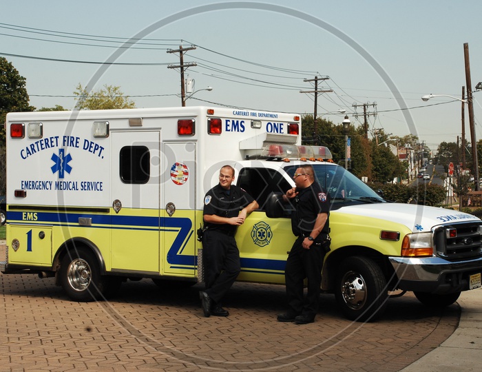 Security Guards standing at the ambulance
