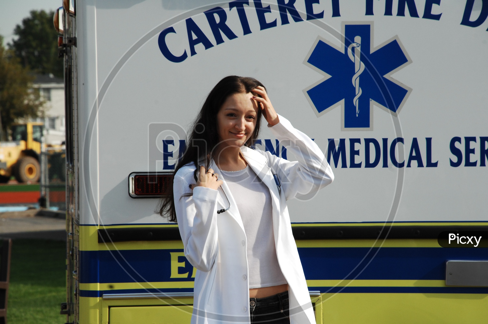 A female doctor wearing white coat with stethoscope