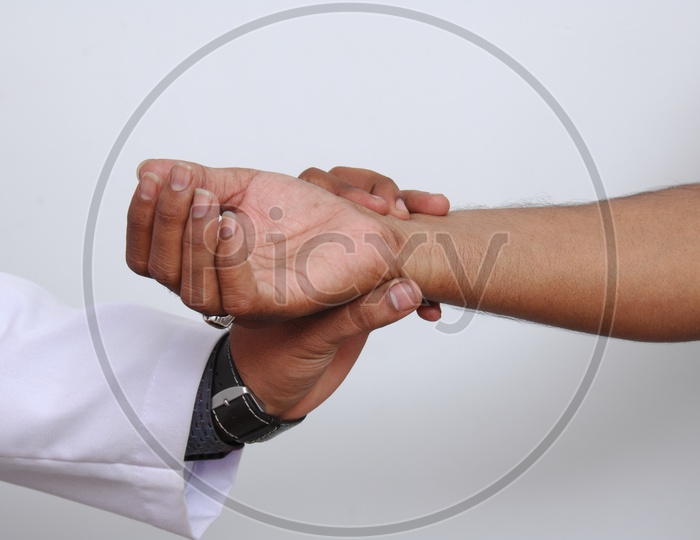 Doctor checking Pulse of a Patient