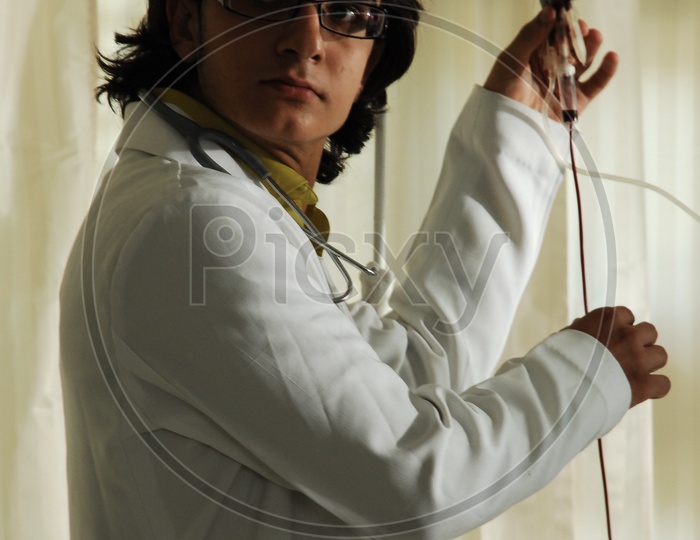 Doctor with a white coat and stethoscope and Blood Bag