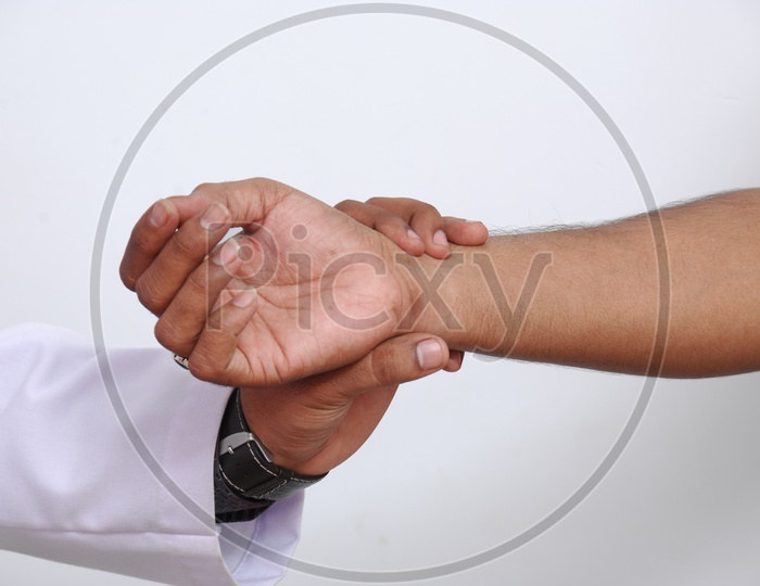 Doctor checking Pulse of a Patient