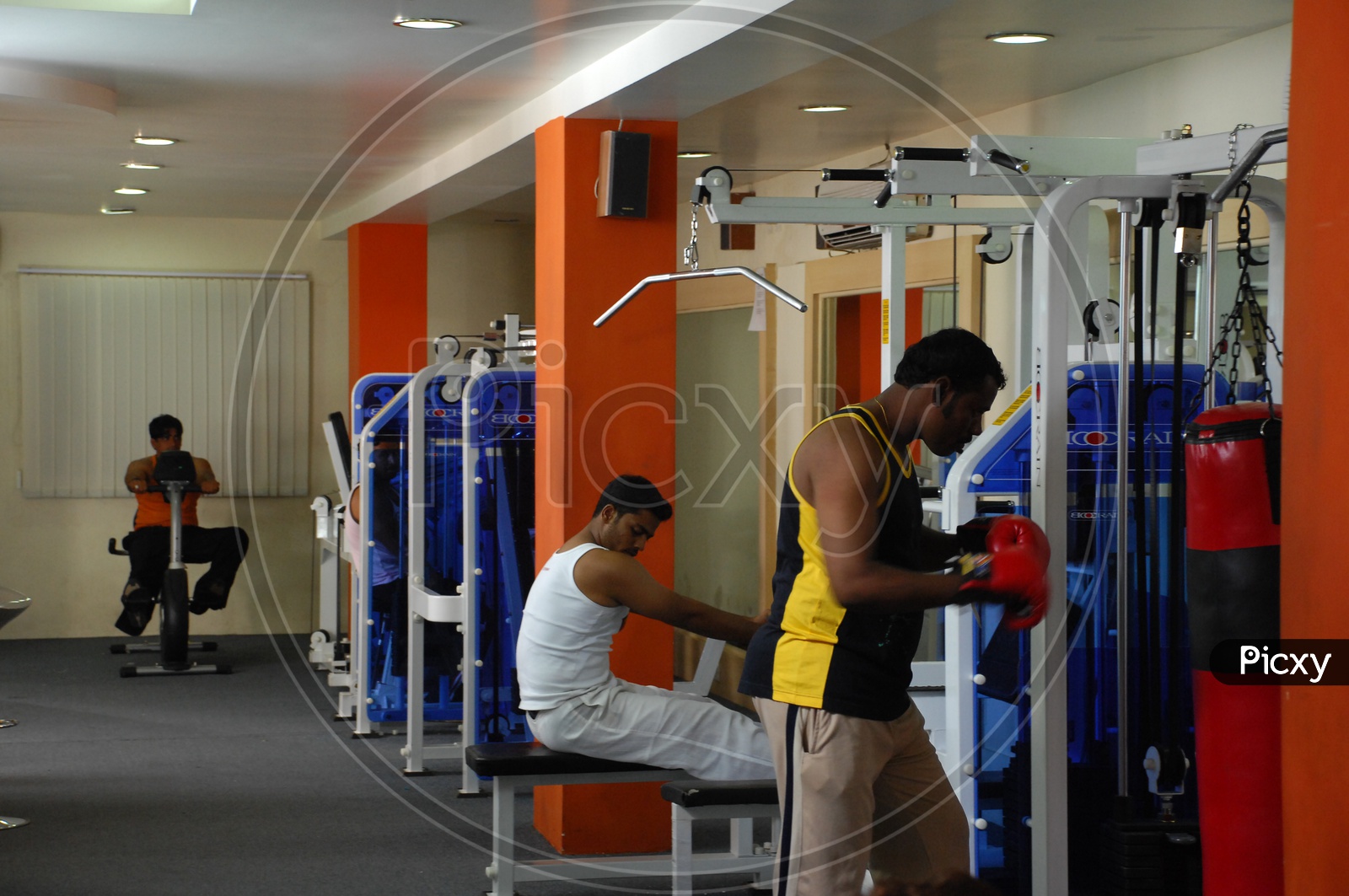 Indian men doing exercising at a gym