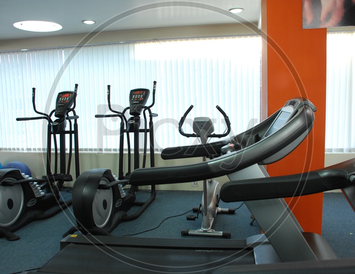 Fitness and strengthening equipment in the gym - Treadmills and Cycles
