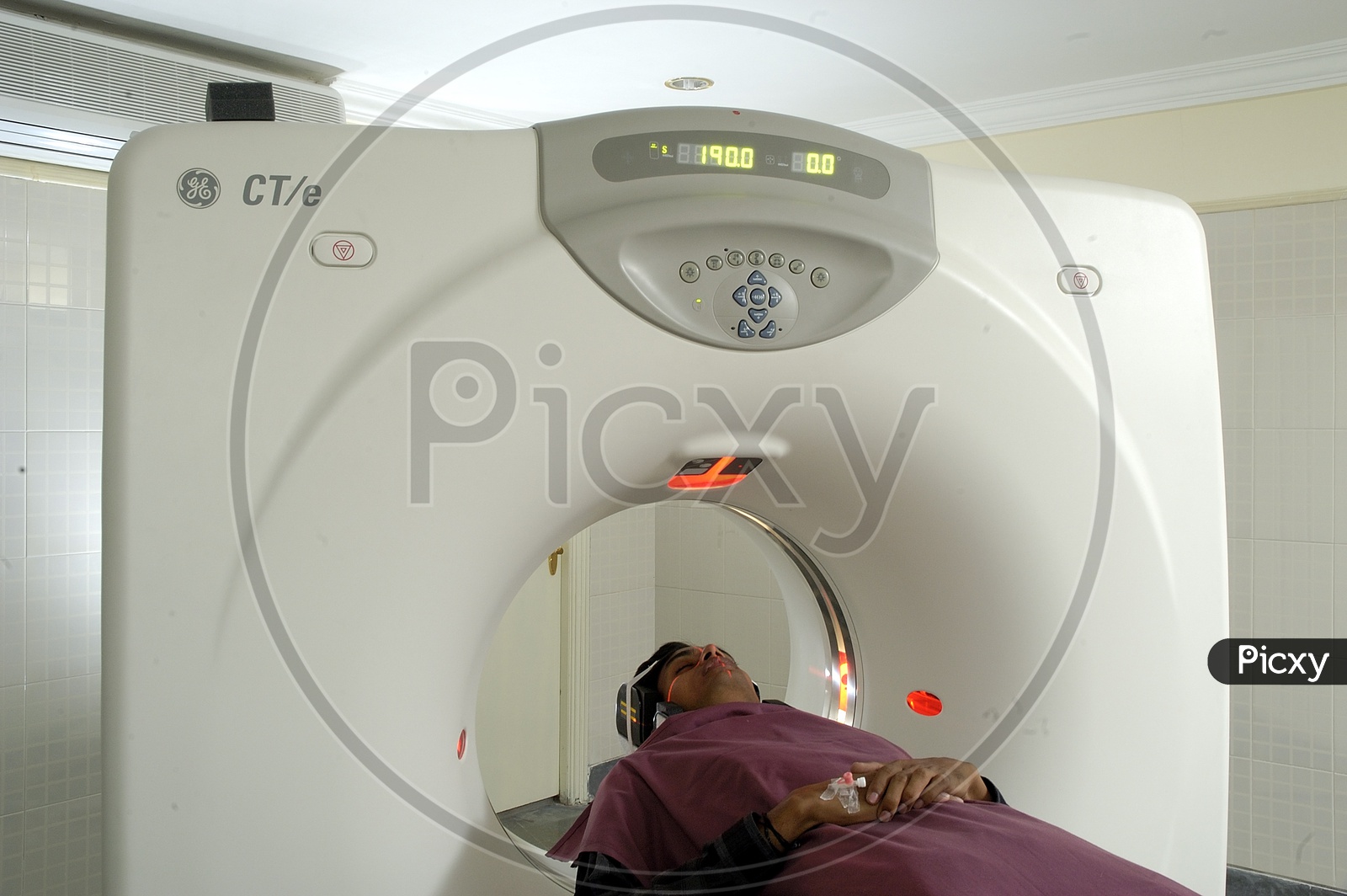 Patient lying on the CT scan bed
