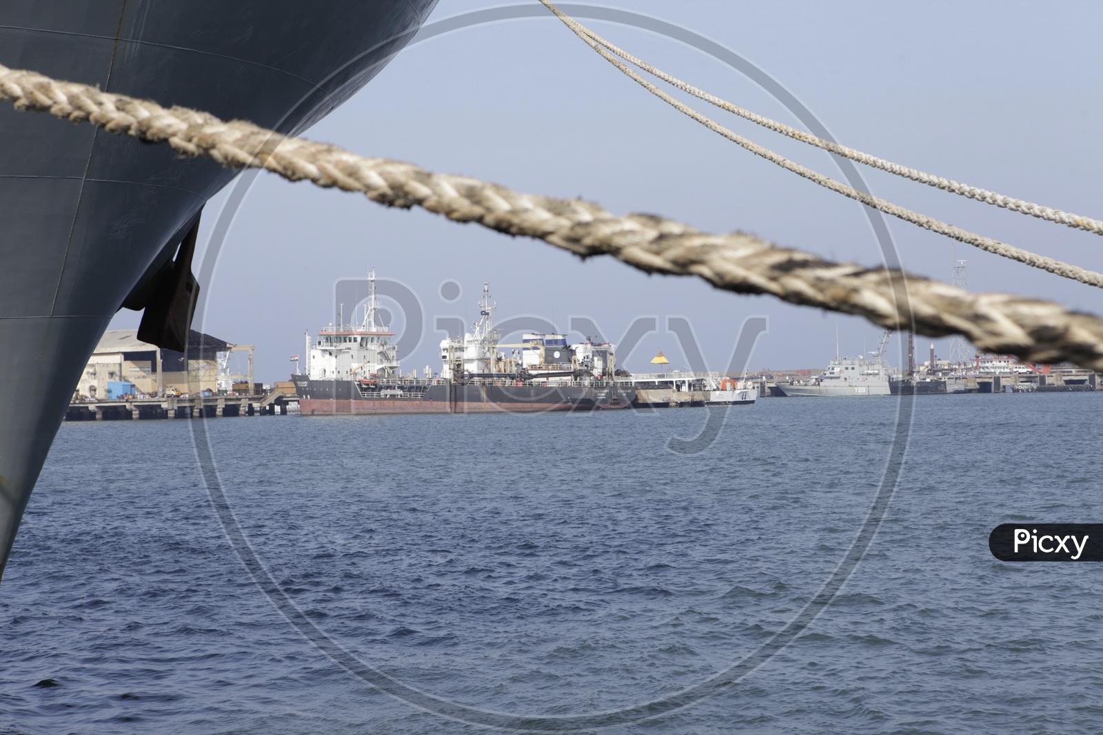 Anchored Ships With Heavy Ropes At Ports