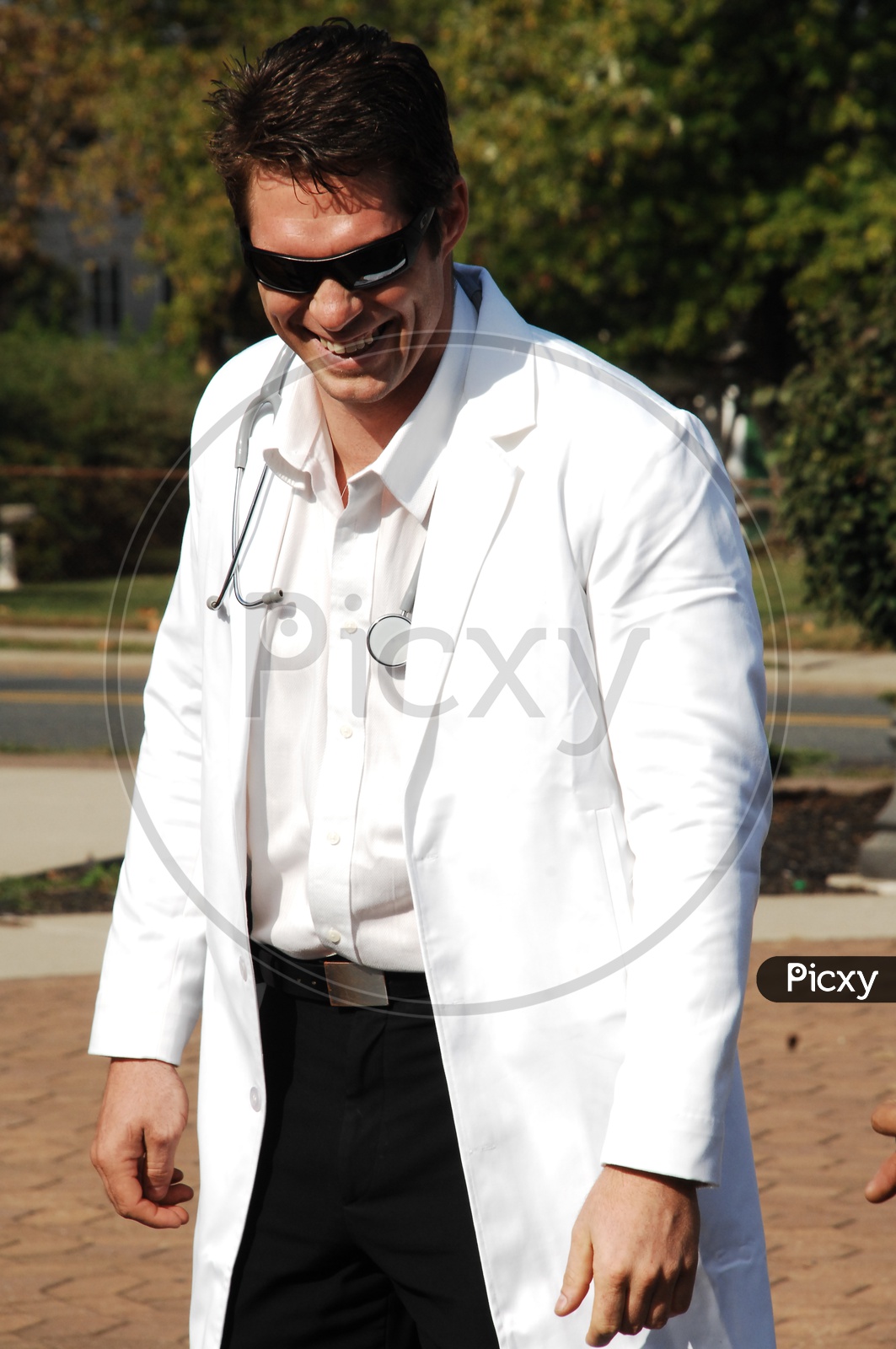 A male doctor wearing white coat with stethoscope