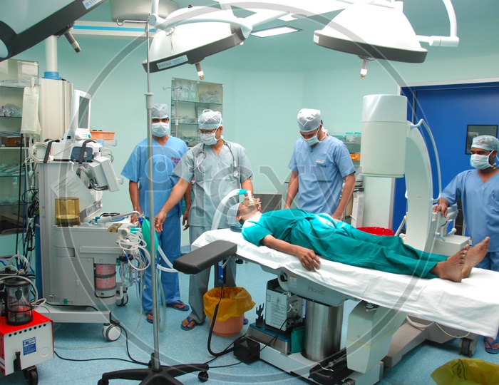 Doctors performing operation to a patient in Operation theatre