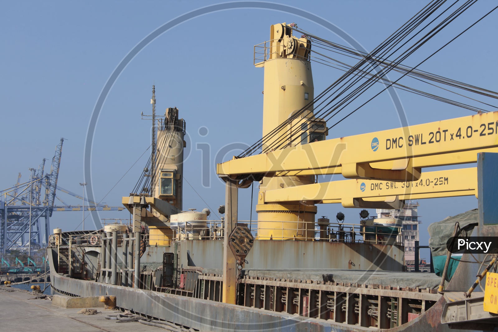Heavy cranes in Anchored Ships at Port