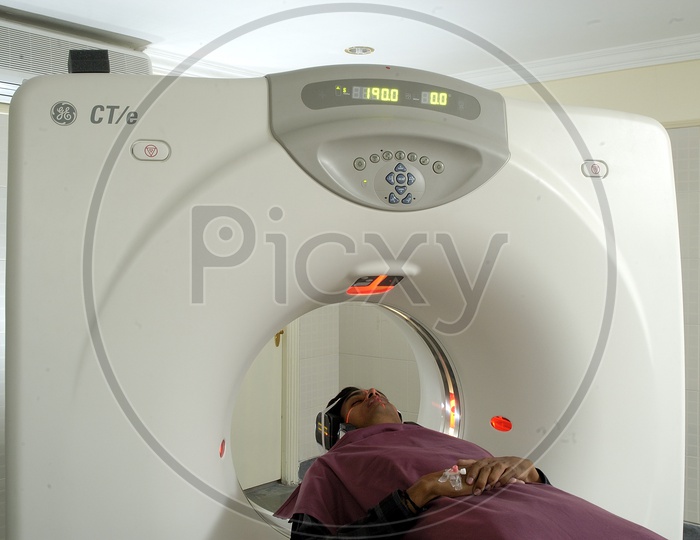 Patient lying on the CT scan bed