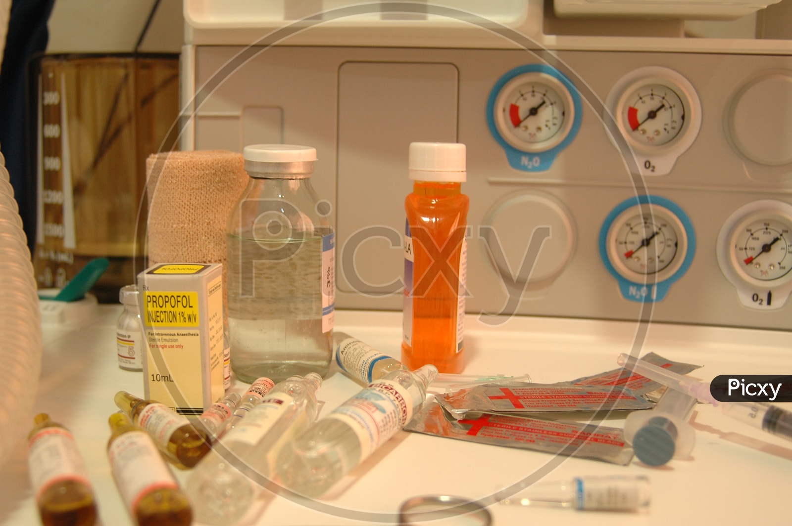Medicine Bottles On a table With Syringe
