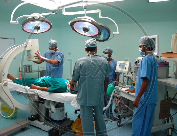 Doctors performing the operation to a patient in Operation Theatre
