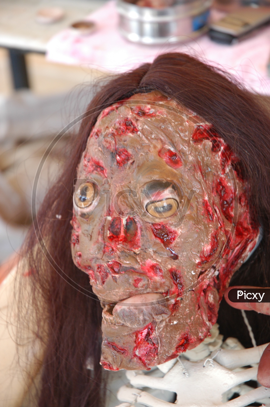 A burnt face mask on a woman  - Movie scene