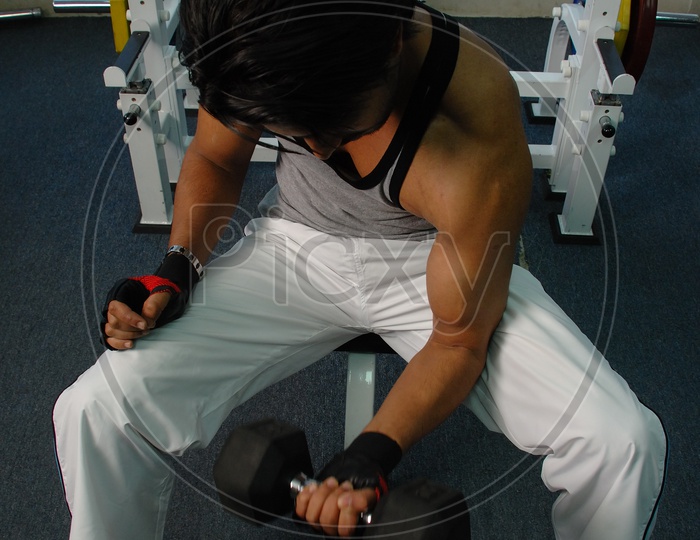 Indian man exercising at a gym