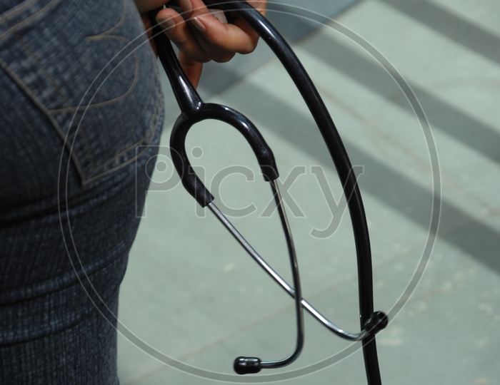Photograph of stethoscope holding in hand