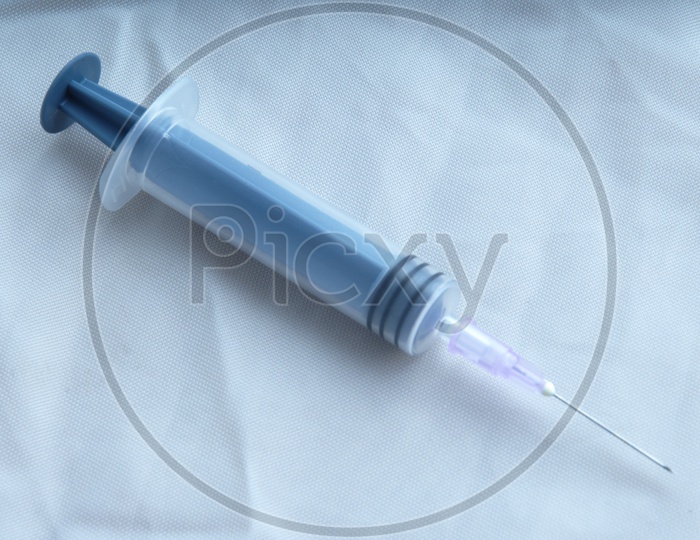 Close up shot of Syringe on white background