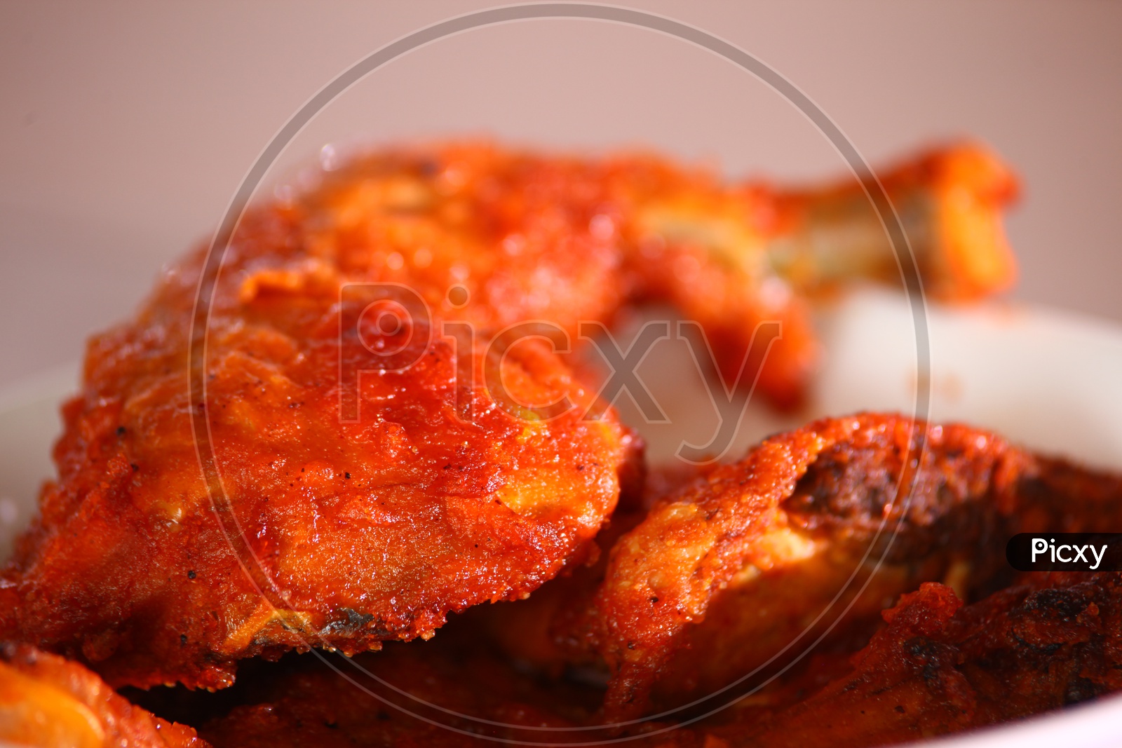 image-of-close-up-shot-of-a-chicken-fry-leg-piece-in-a-white-bowl