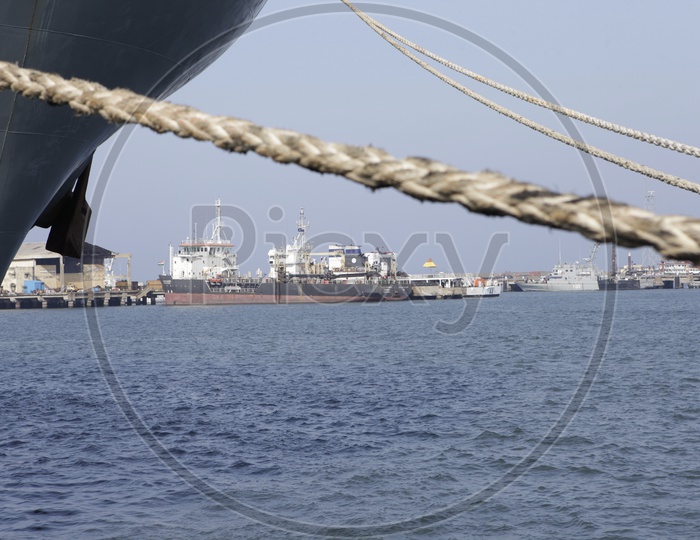 Anchored Ships With Heavy Ropes At Ports