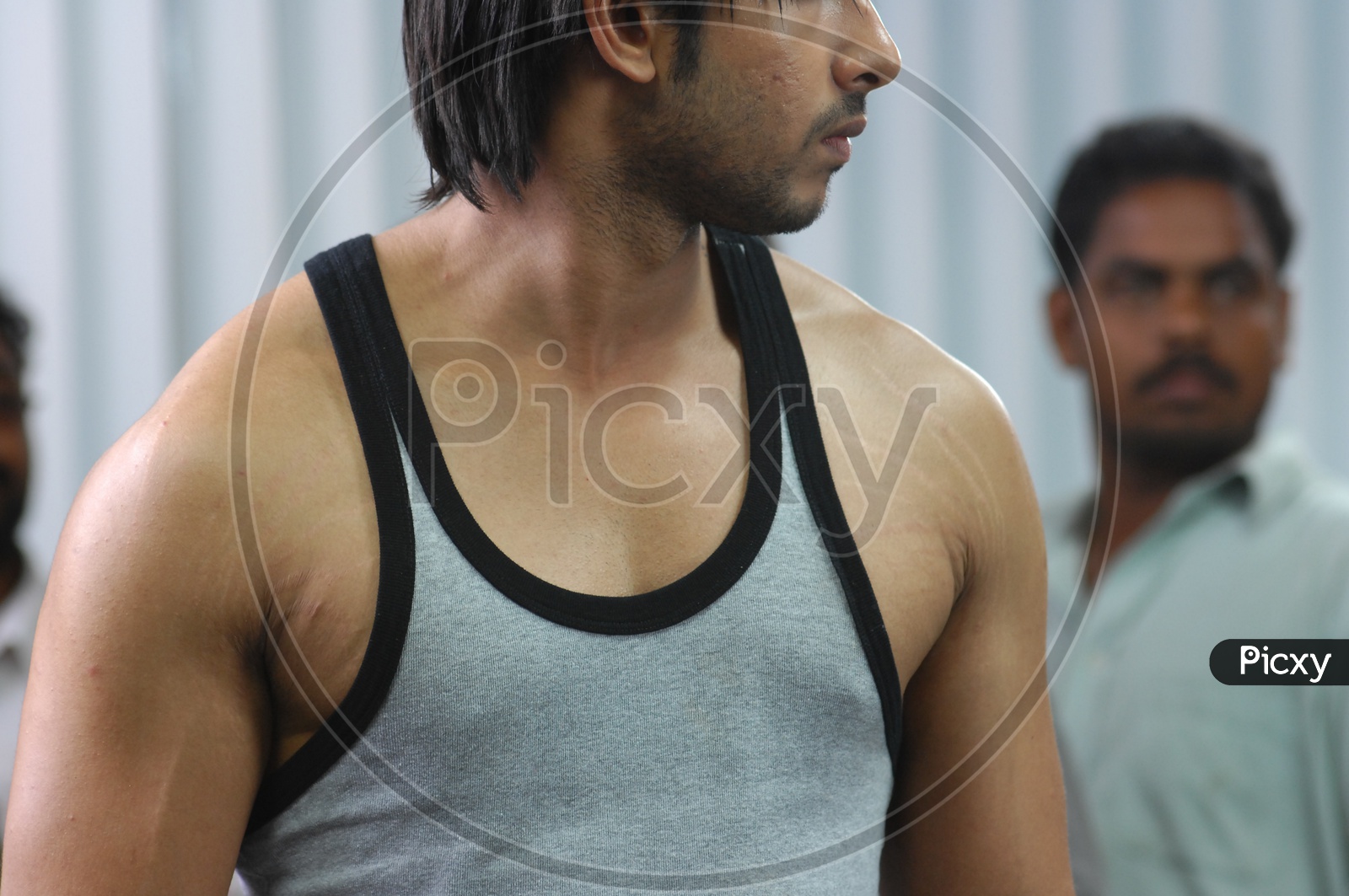 Indian man in a vest at a gym