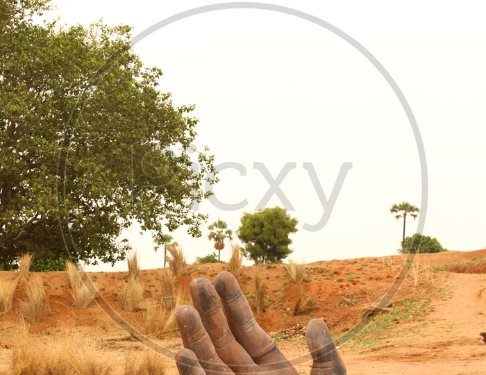 Hand statue alongside the Rural Road