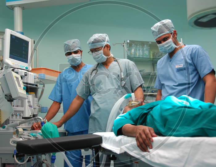 Doctors performing the operation to a patient in Operation Theatre