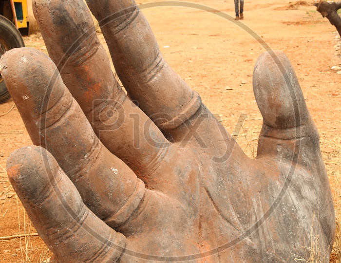 Palm of the Hand statue alongside the Rural Road