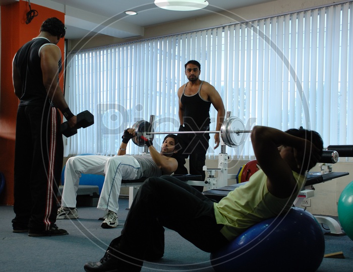 Indian men exercising at a Gym