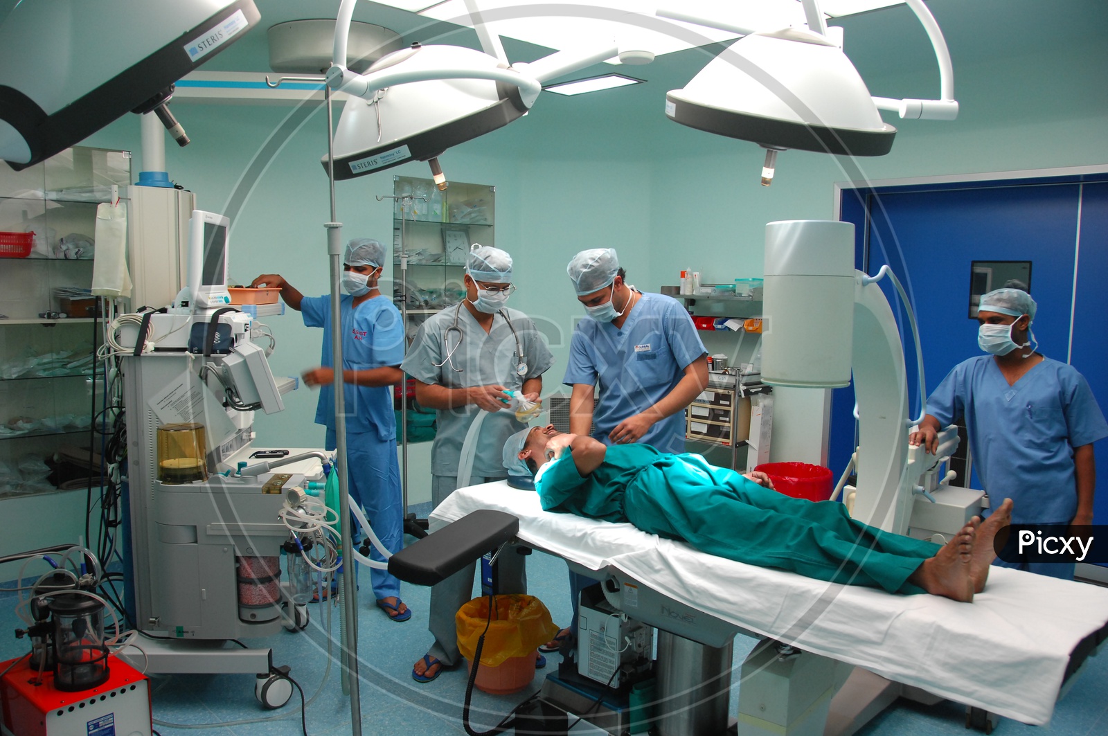 Doctors performing operation to a patient in Operation theatre