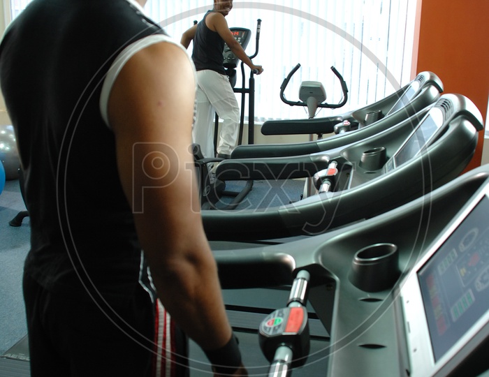 Indian men exercising at a gym
