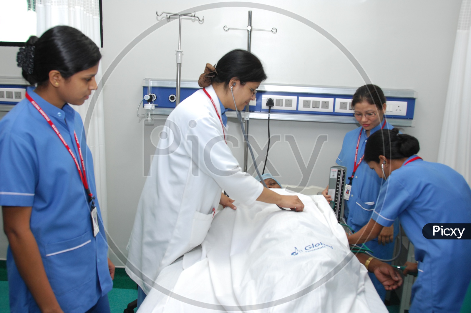 Doctors Checking Patient In a Hospital ICU