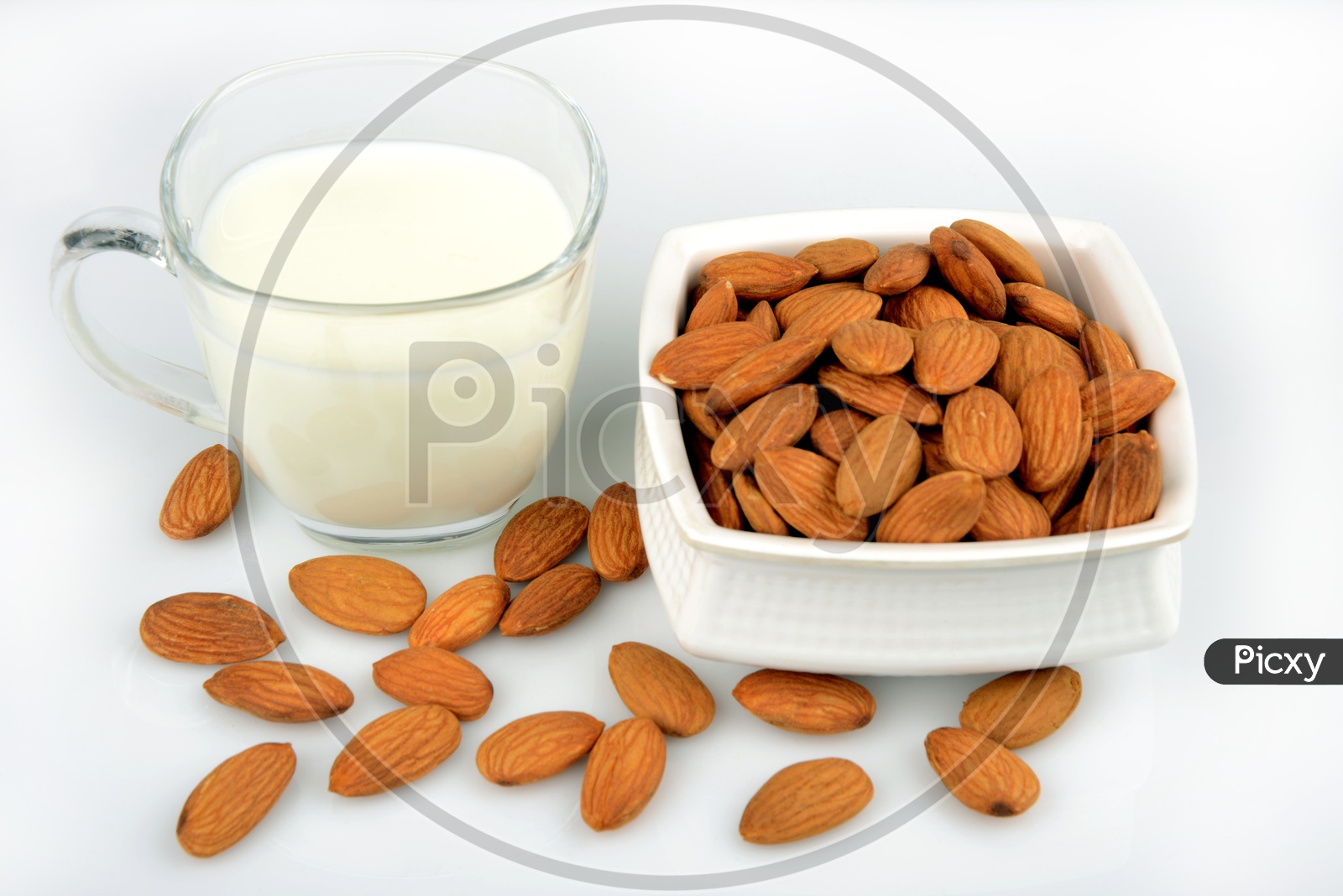 Healthy food, Dryfruit Almond Seeds in a bowl and a cup of fresh milk